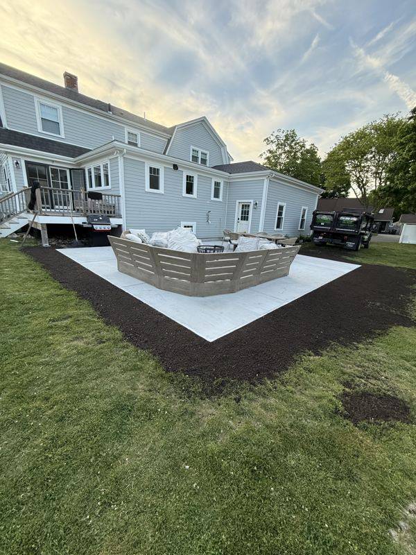 Clean patio edges meeting a healthy, even lawn