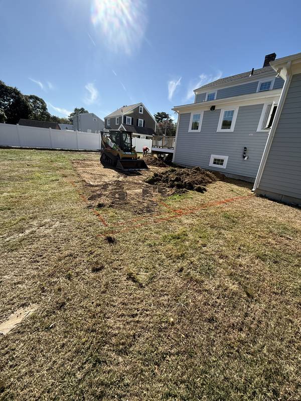 Backyard lawn before excavation for the new patio