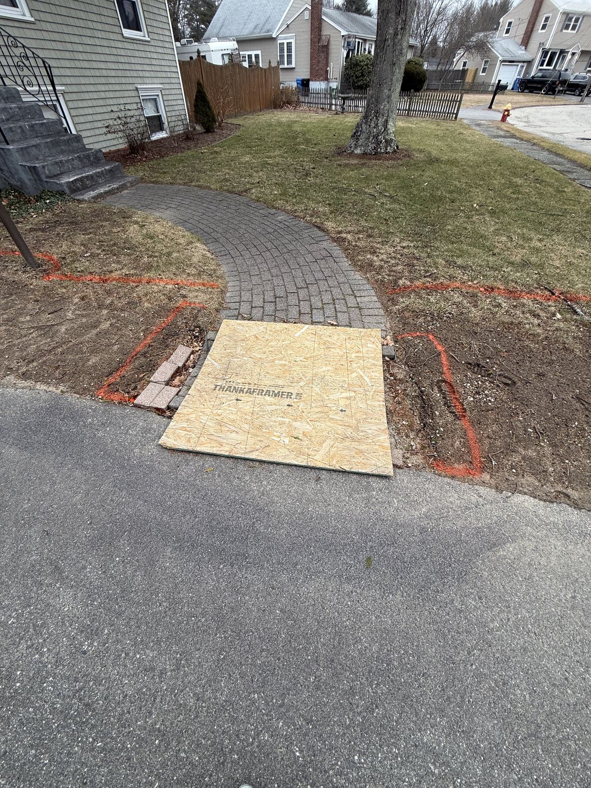 Old walkway and bed lines marked out for removal