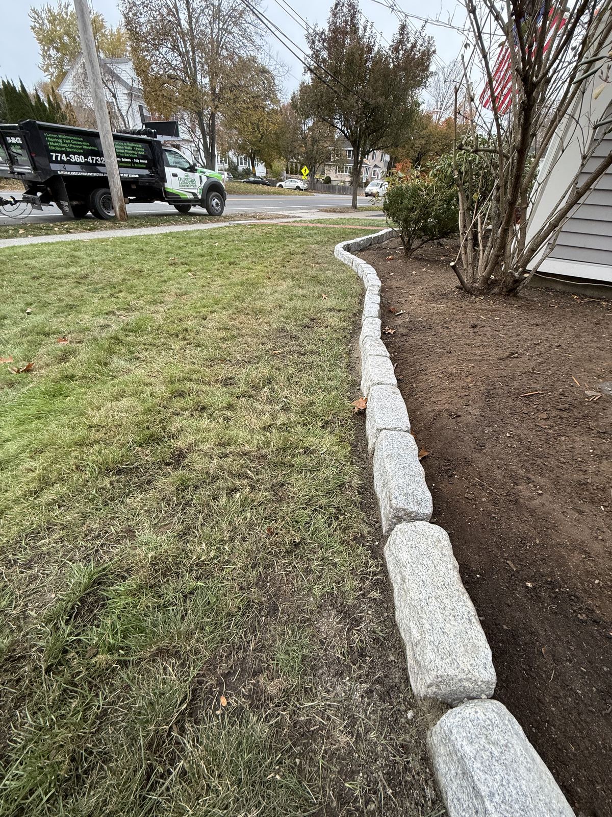 Long run of granite edging along the house