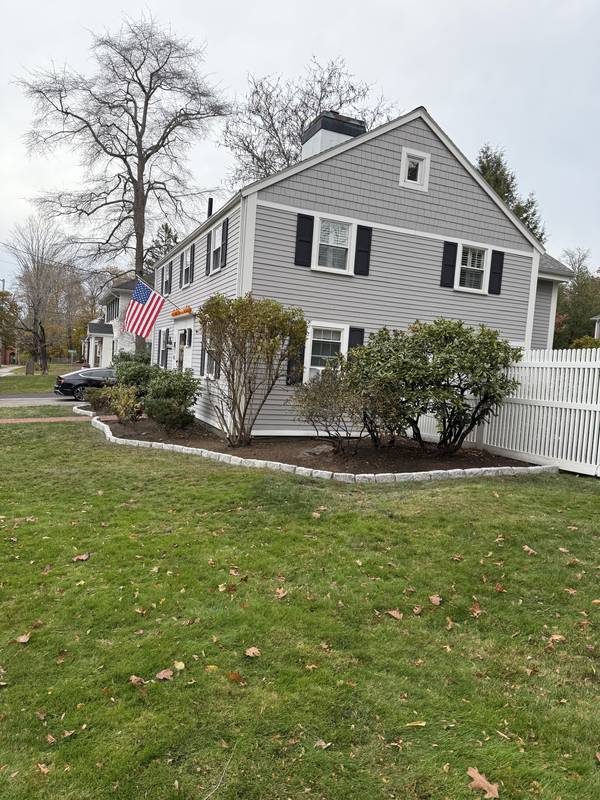 Finished granite-edged beds around the colonial home