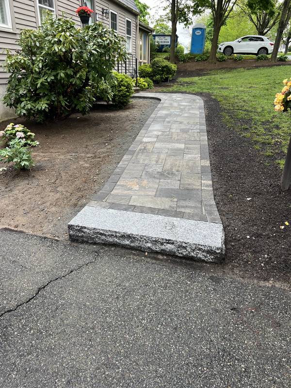 Paver front walkway with granite step and new plantings