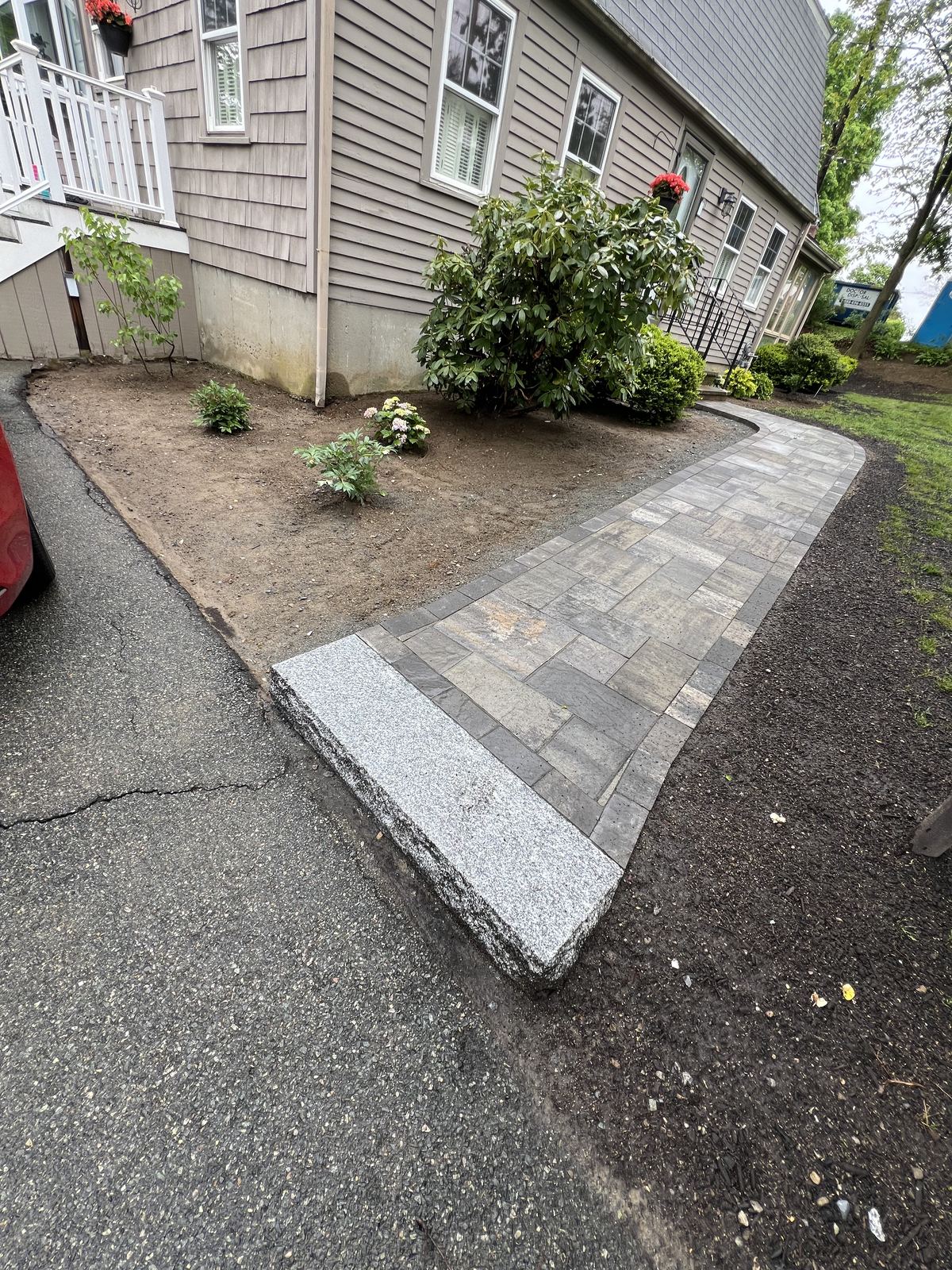Walkway and foundation bed seen from the driveway
