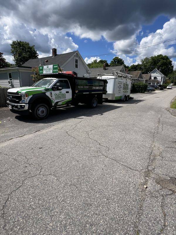 Oliveira team member maintaining a backyard property