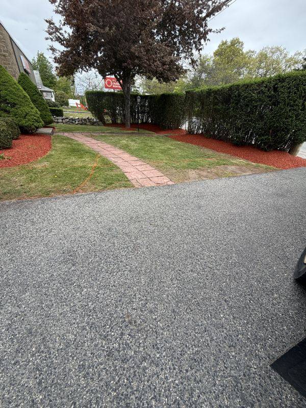 Planning and edging the new bed lines along the driveway