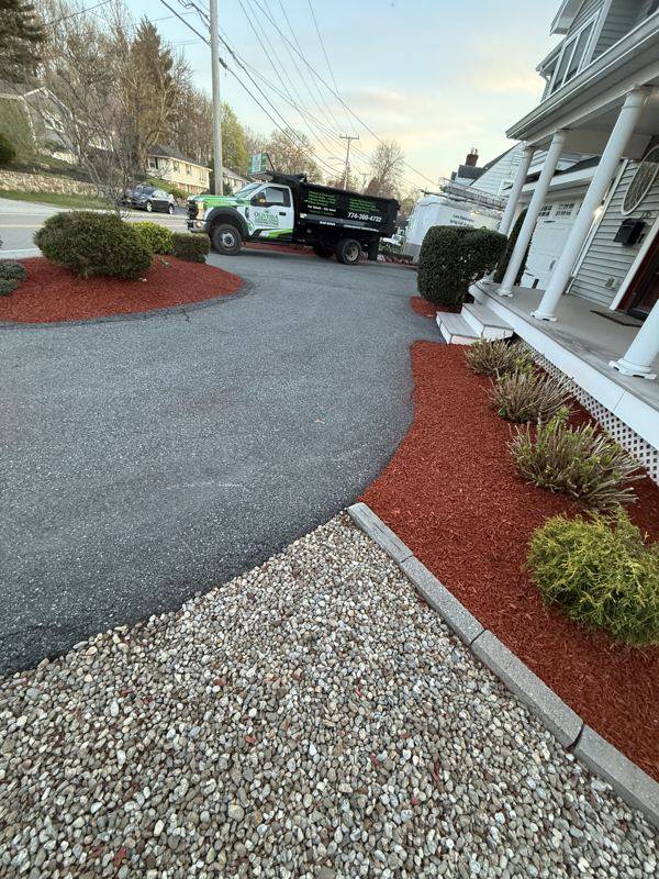 Healthy lawn paired with freshly mulched borders