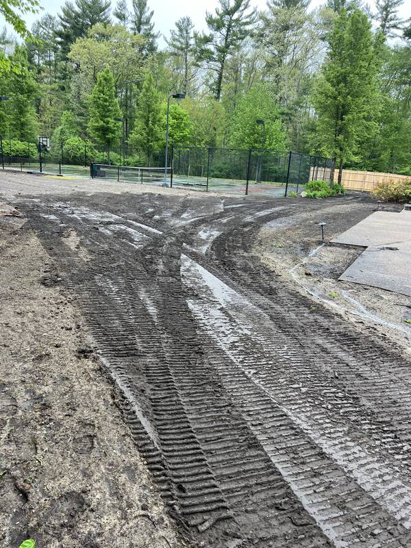 Side yard rough-graded after equipment work