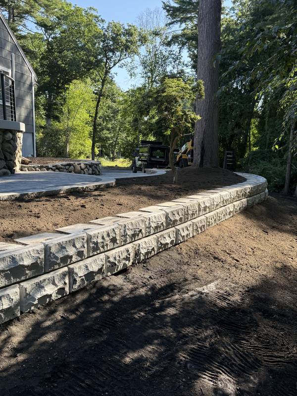 Finished block retaining wall ready for loam and plantings