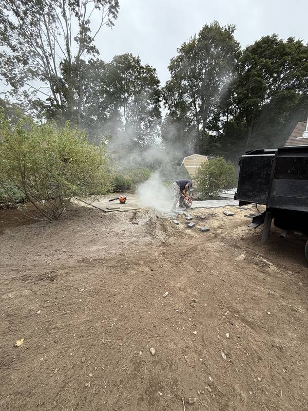 Cutting pavers and preparing the base on site