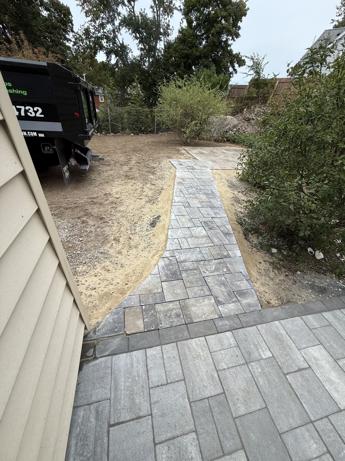 New paver walkway leading from the house into the yard