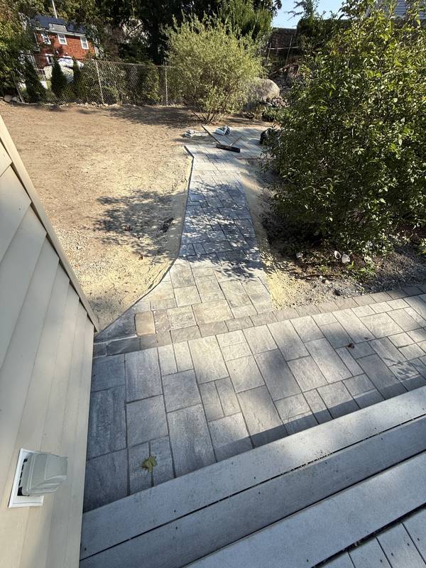 Finished paver path along the side of the home
