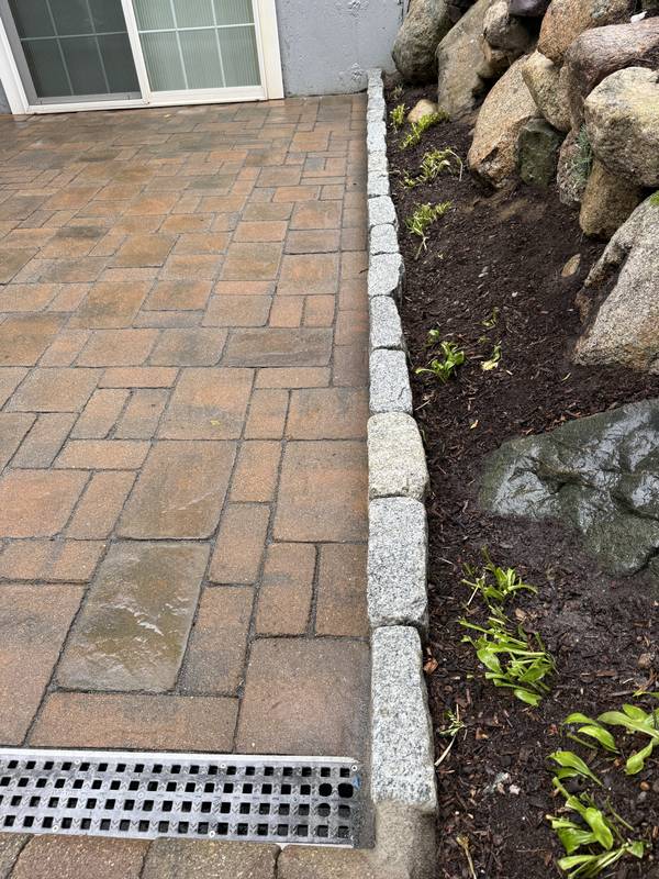 Channel drain set flush into the paver surface