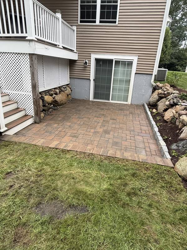 Walkout patio connecting the basement door to the yard