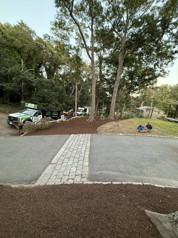 Wooded Lot Regrade, Boulder Wall & Mulch Beds by Oliveira Landscaping in South Shore, MA